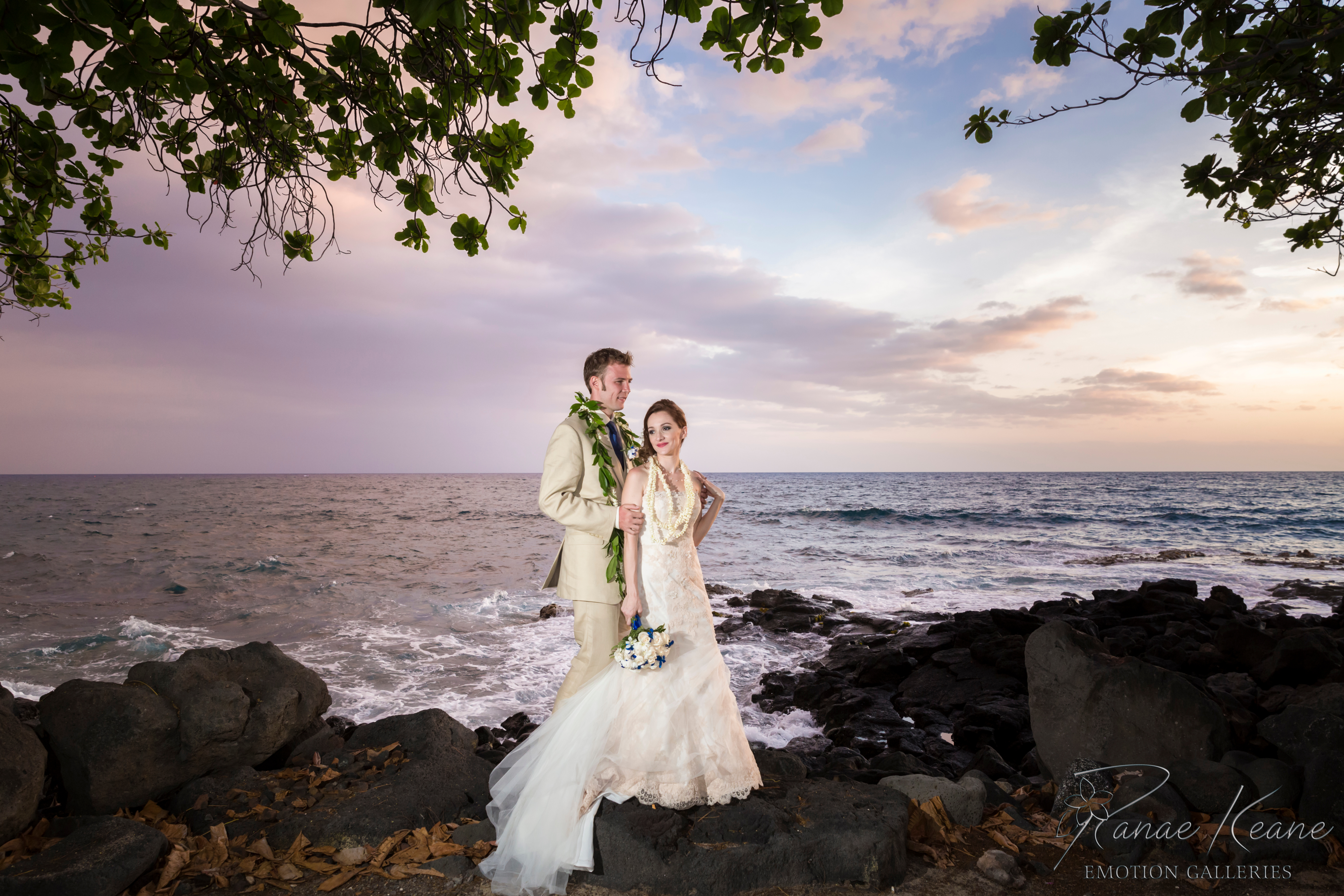 A couple holding hands at sunset